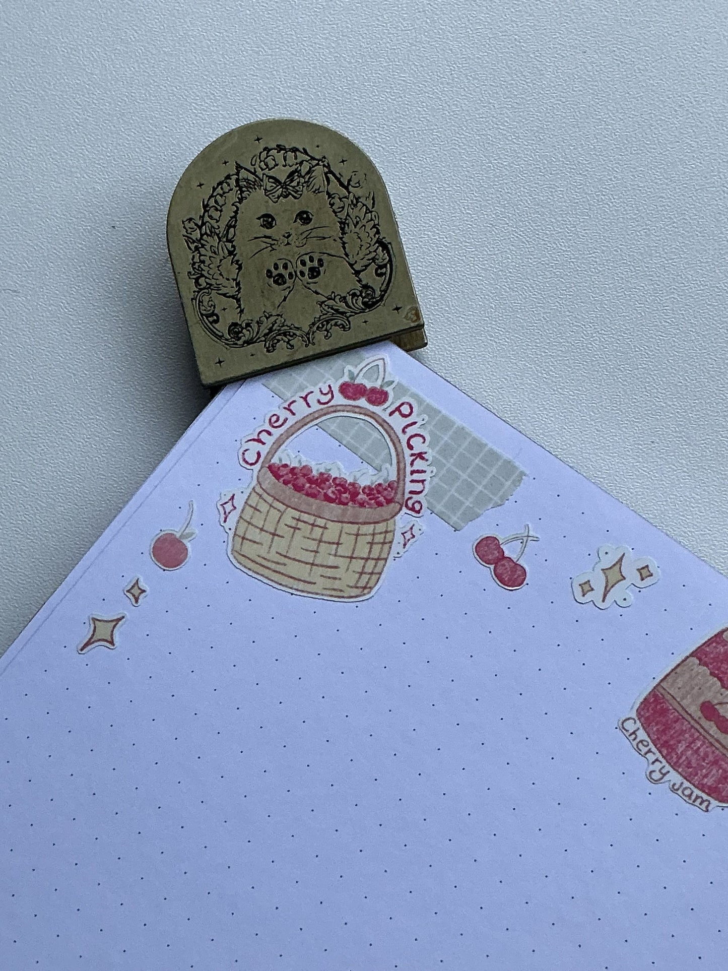 Cherry picking sticker and cherries surrounding corner of journal page entry